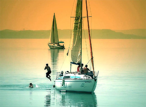 Book sailing boat with a professional skipper. Rent a boat on Balaton lake. Sailing on a Balaton lake